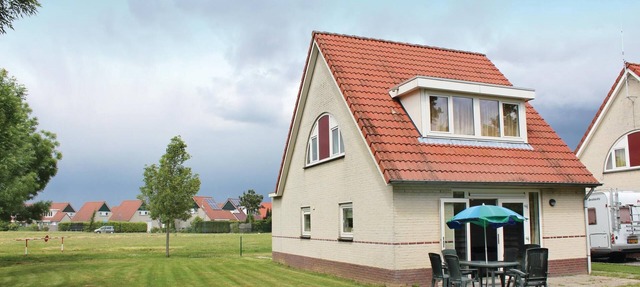 This comfortable villa is located in the villa park Porta Isola. in Stevensweert
