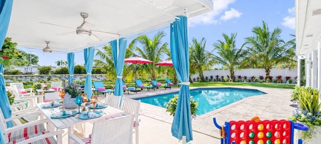 Waterfront Heated Pool Home w/Putting Green, Pergola & Air Hockey in Boynton Beach