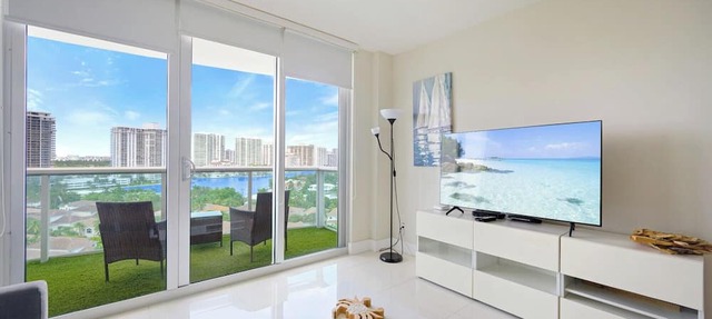 Modern condo w/bay views. WiFi, parking, tennis, playground and more! in Sunny Isles Beach.